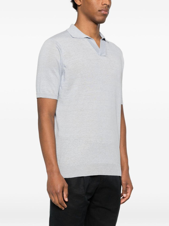 Polo azzurro polvere con scollo a V 