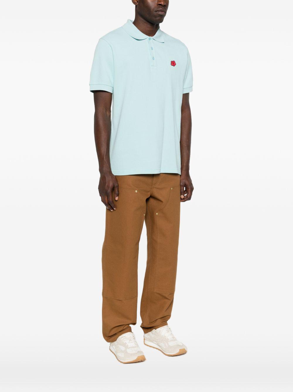 Polo con patch floreale glace 