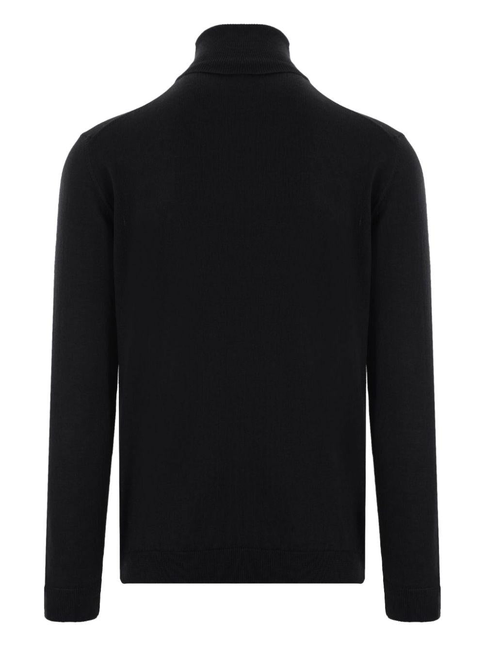 Maglione nero a collo alto in lana merino 