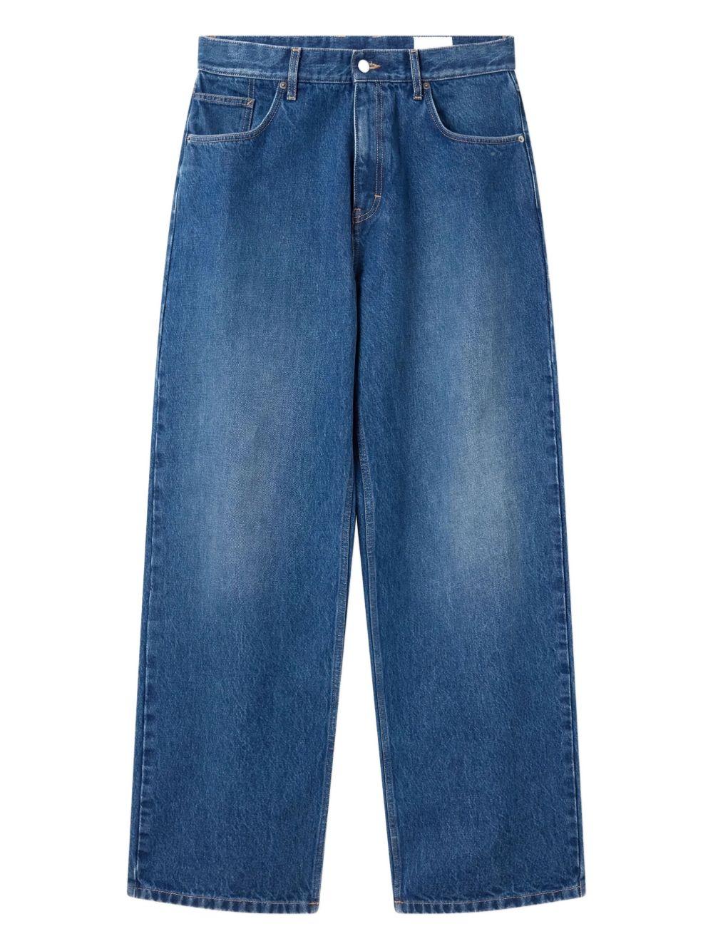 Jeans blu a gamba ampia con effetto vissuto 