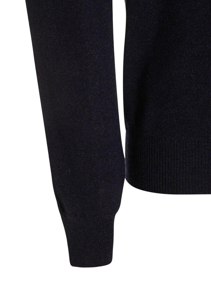 Maglione blu scuro a coste a collo alto 