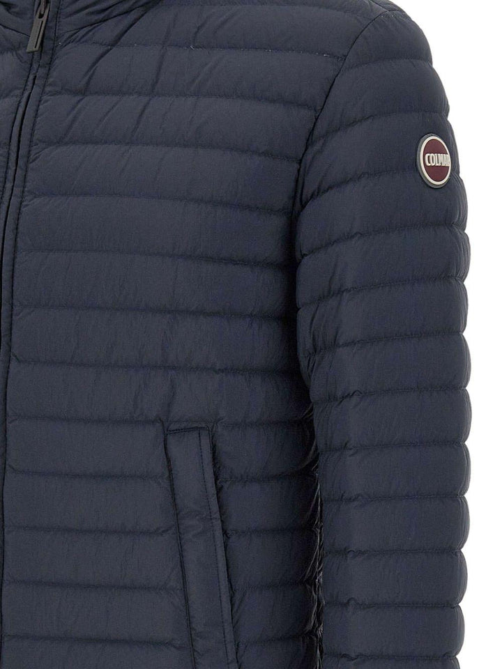 Piumino trapuntato blu con cappuccio 