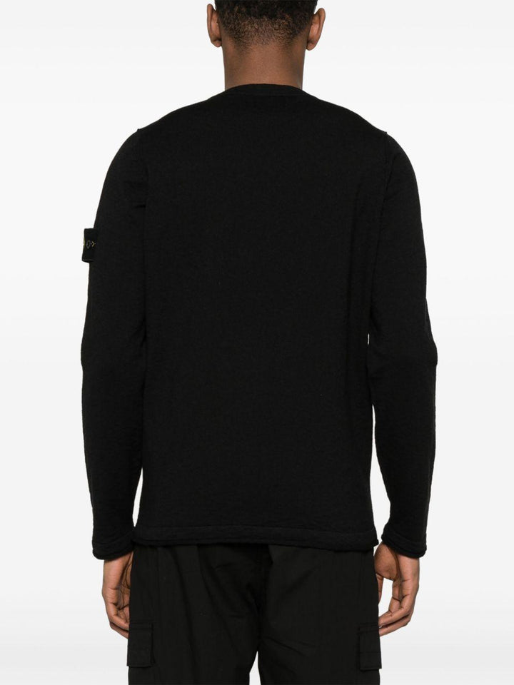 Maglione nero con applicazione 