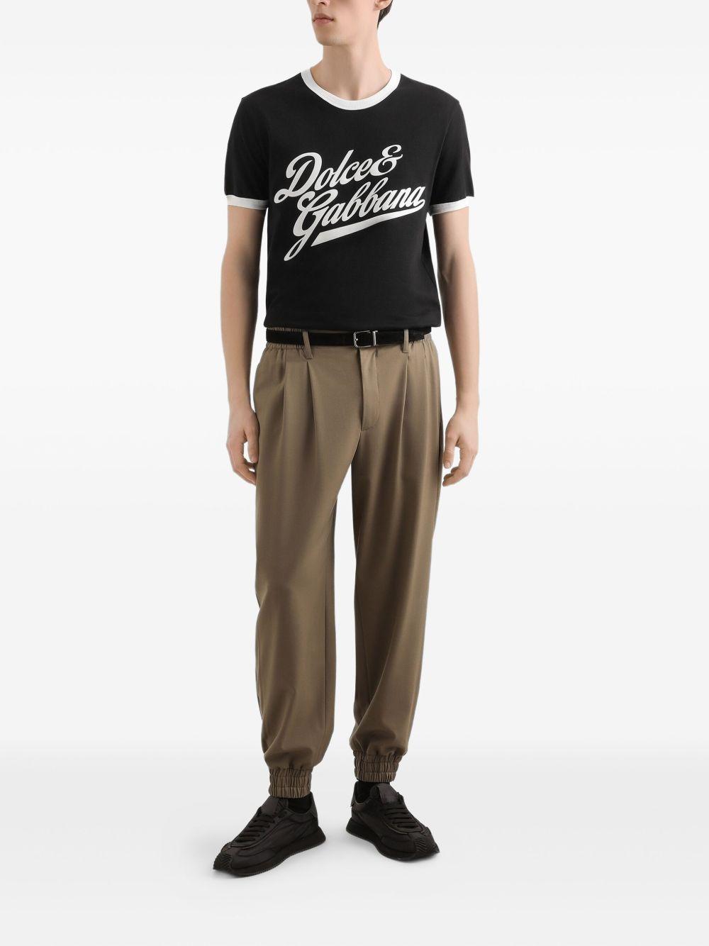 T-shirt nera in cotone con logo stampato 