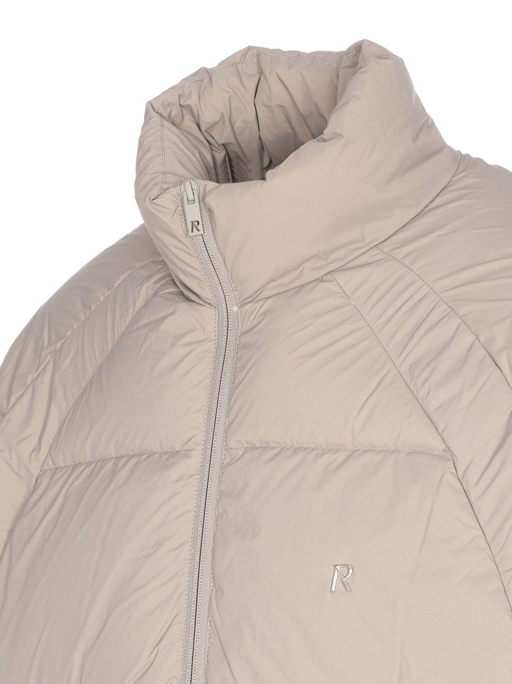 Piumino con collo a imbuto beige 