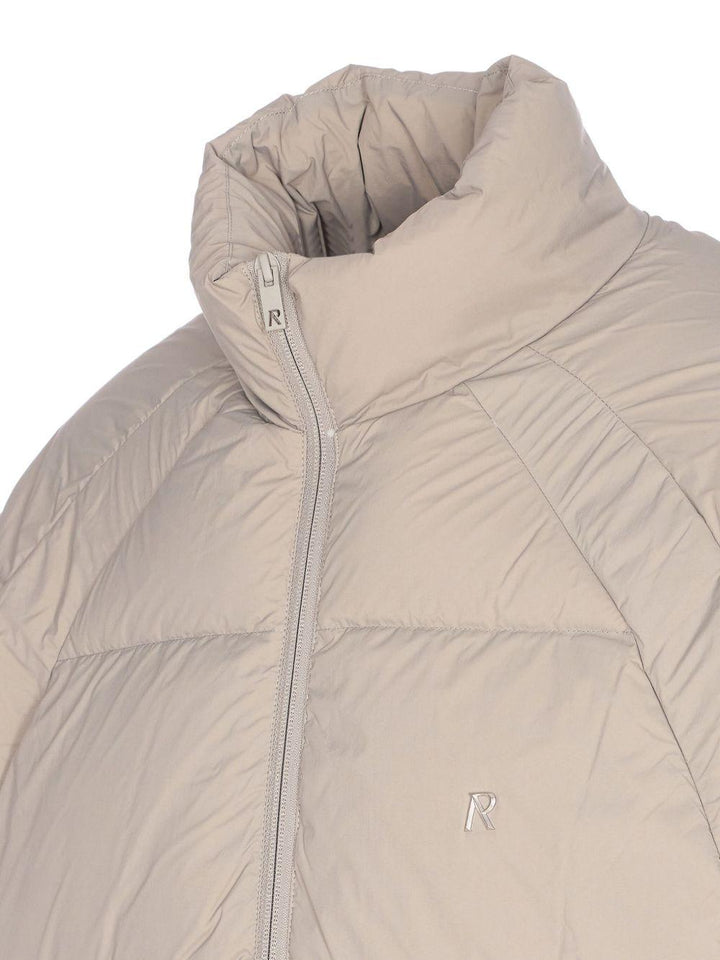 Piumino con collo a imbuto beige 