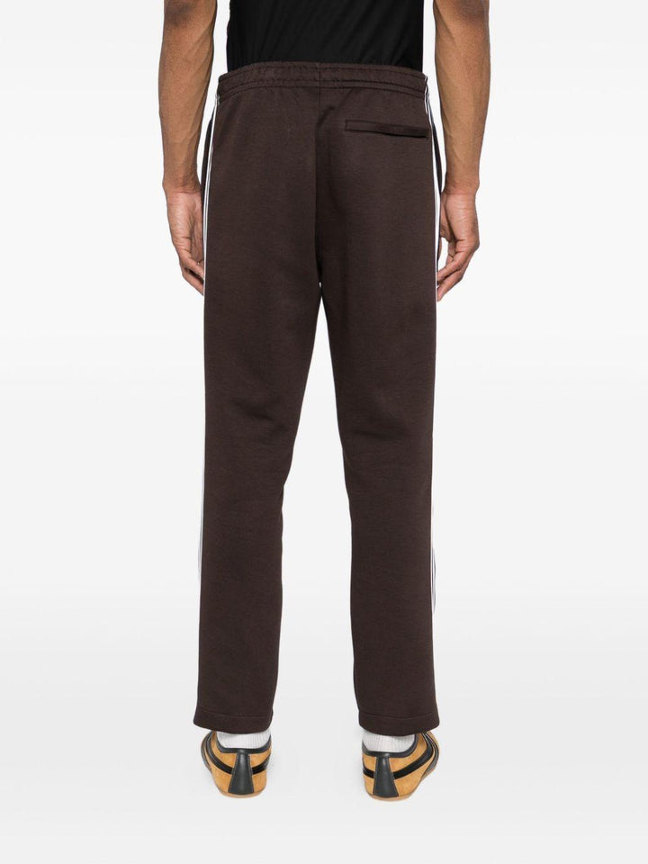 Pantaloni marrone cedro con logo