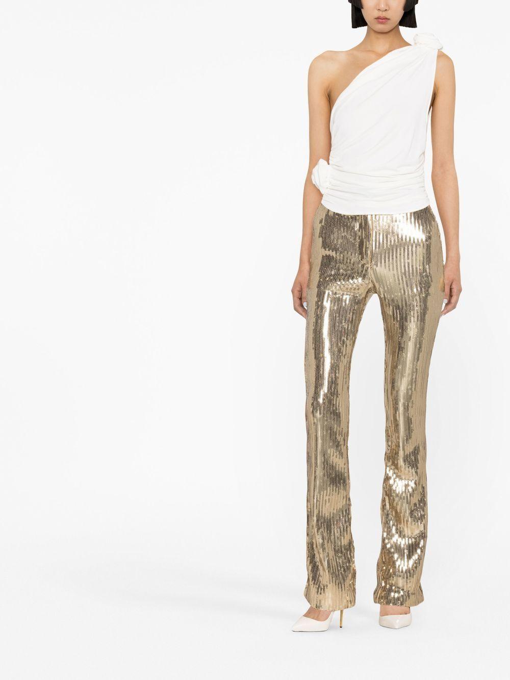 Top monospalla con fiore 