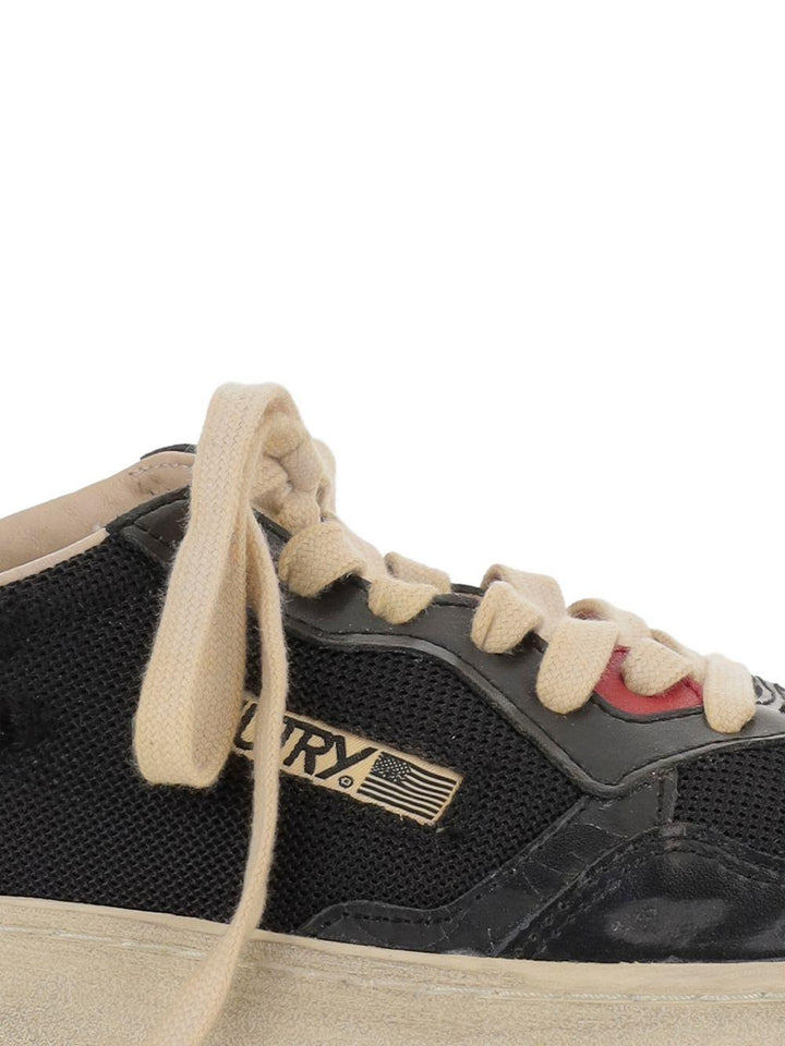 Sneakers nere con inserti 