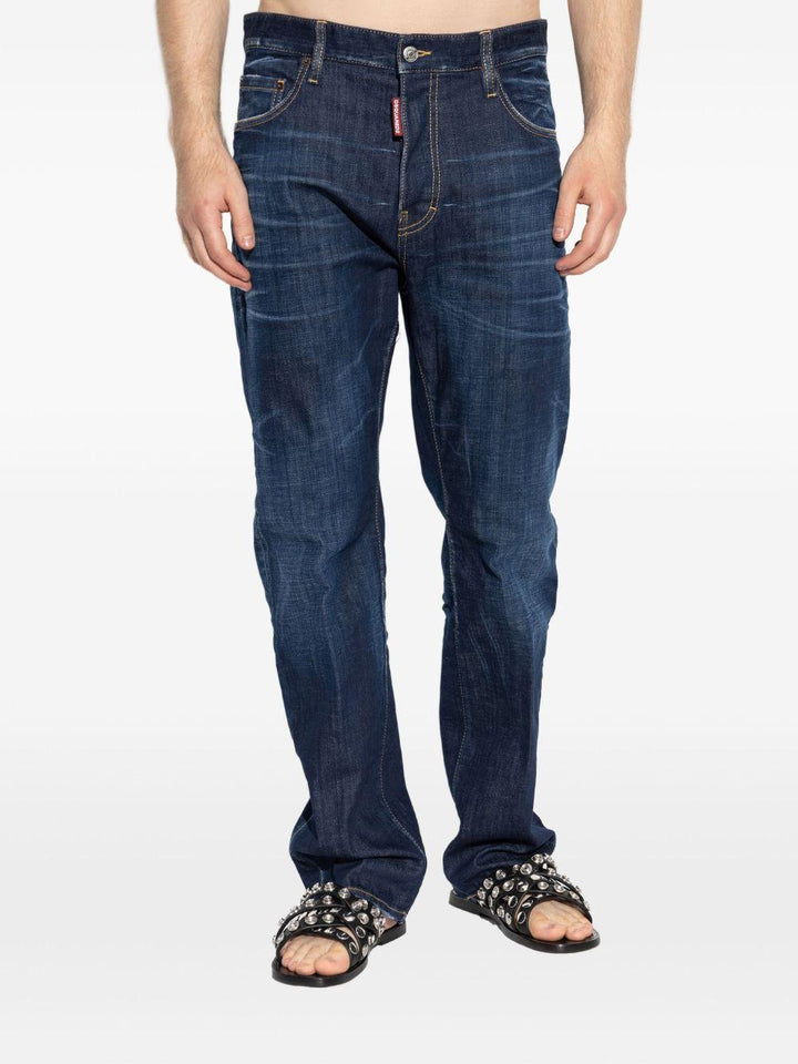 Jeans indaco in cotone con applicazione logo 