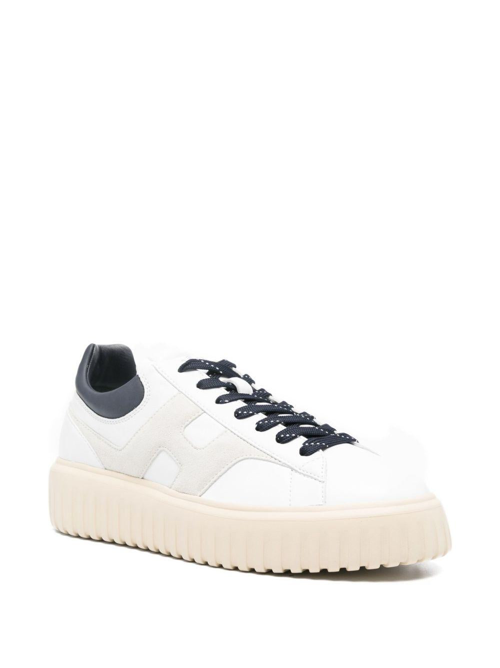 Sneakers bianche in pelle con suola rialzata 