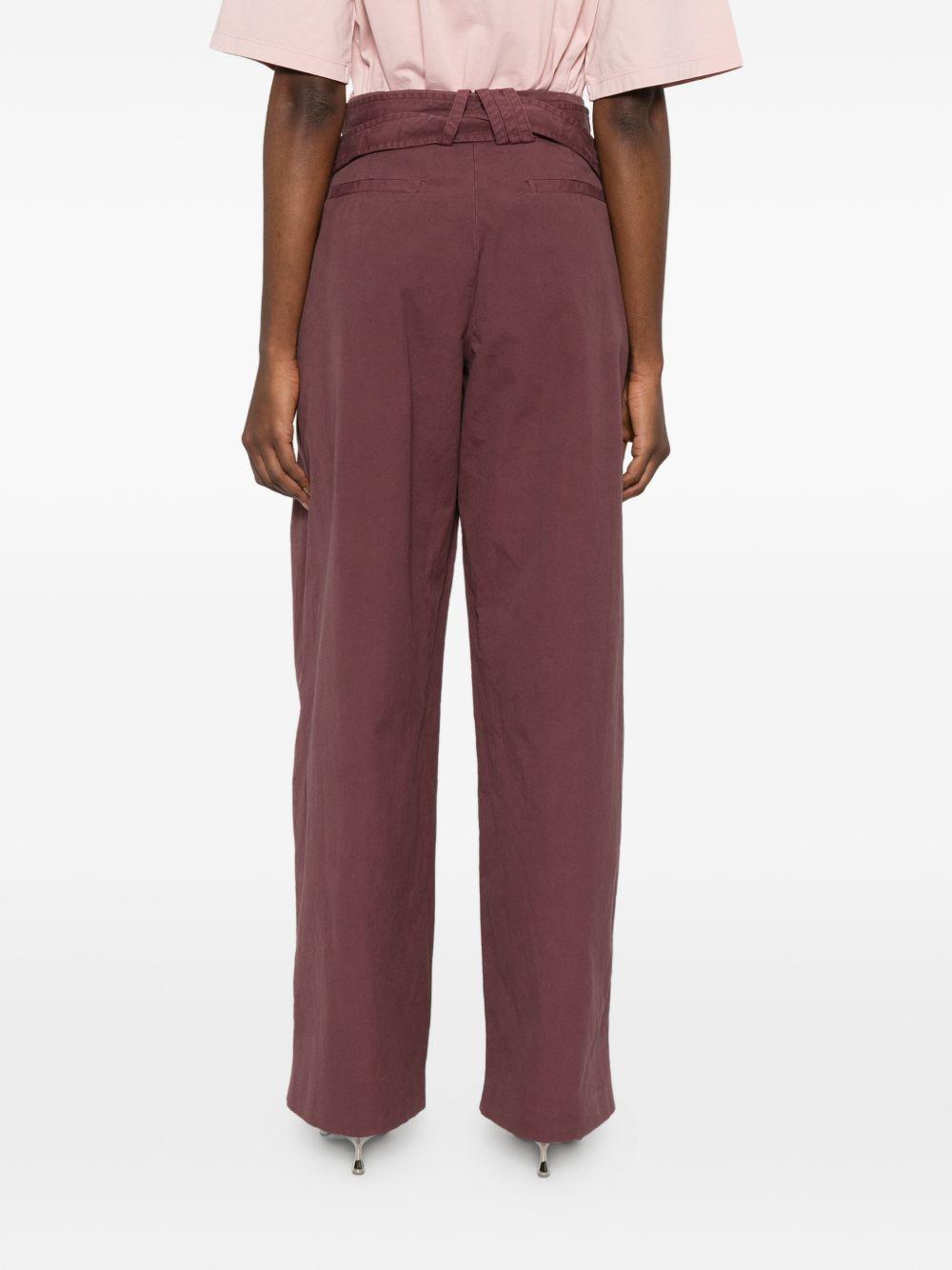 Pantaloni con fibbie 