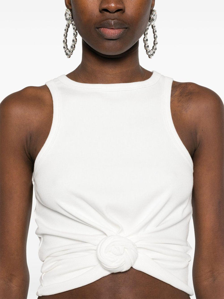 Top con fiore 