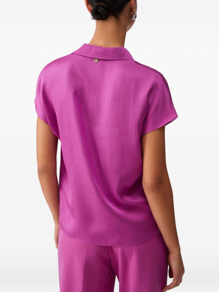 Blusa con scollo a V 