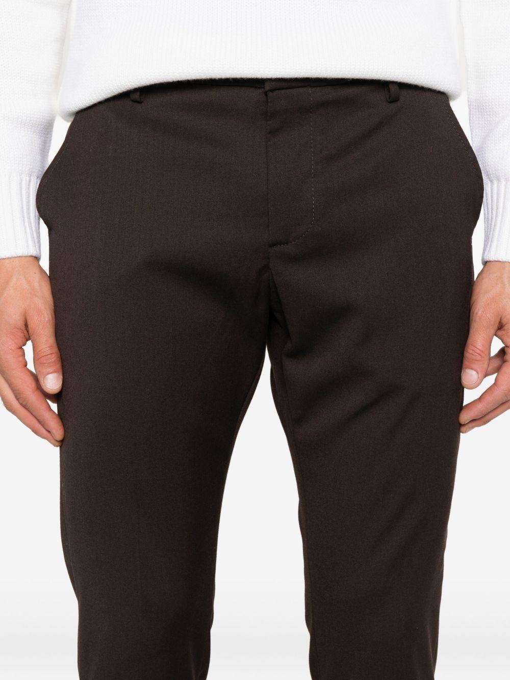 Pantaloni marroni Gaubert in lana con risvolti 