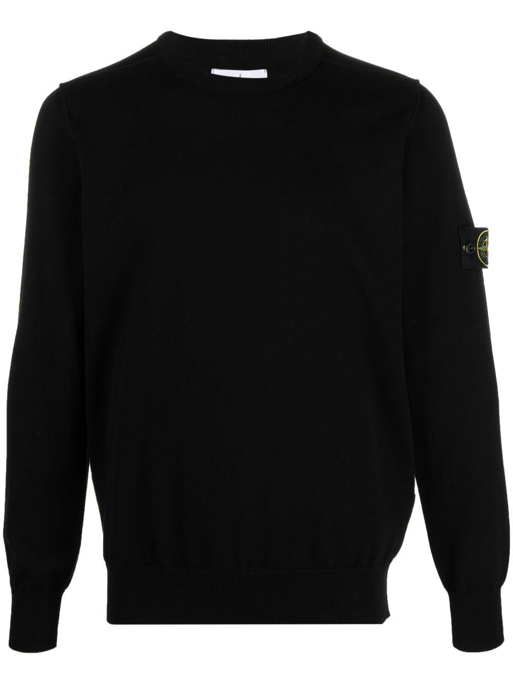 Maglione nero con applicazione 