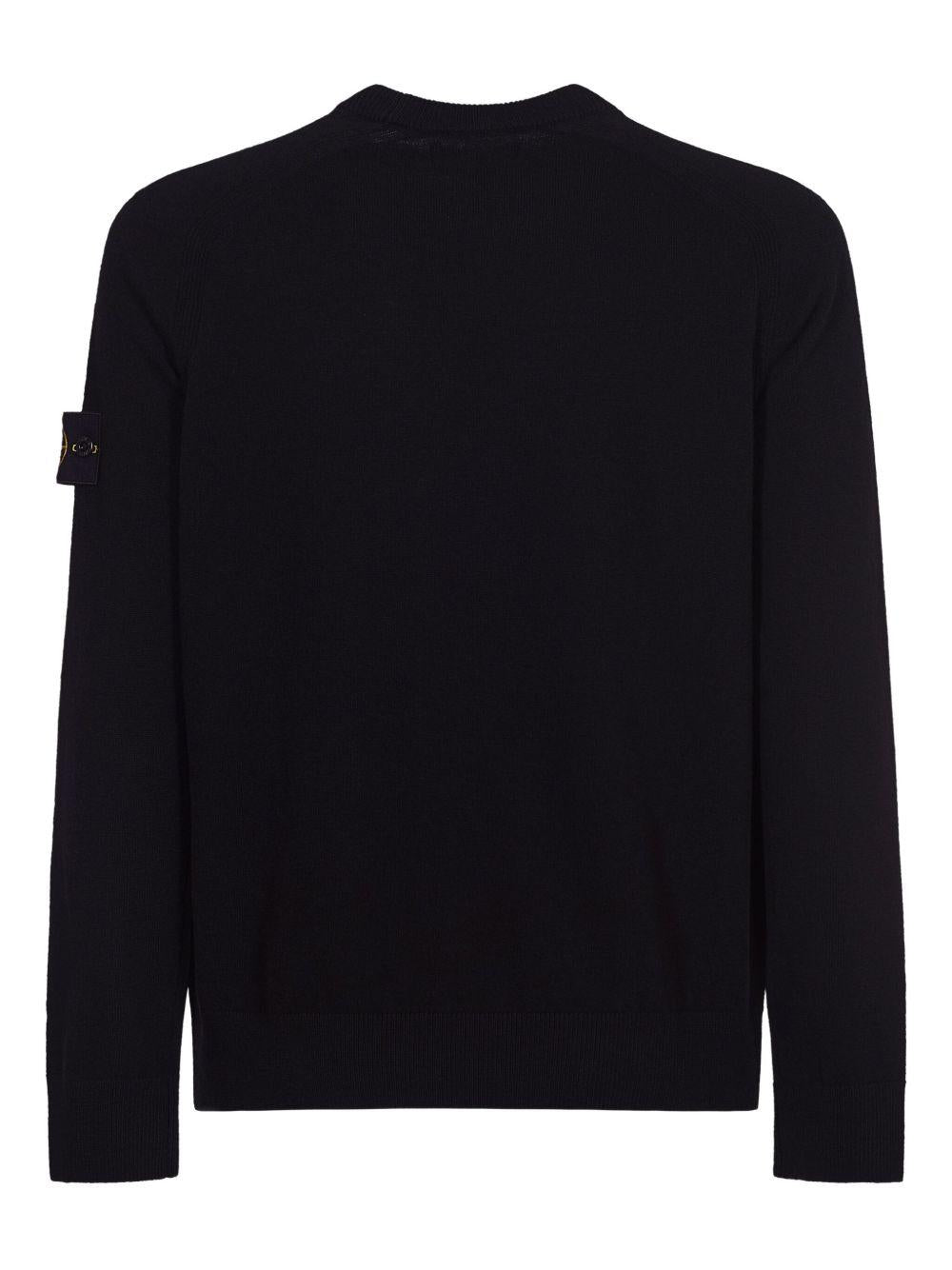 Maglione nero girocollo con dettaglio a coste 