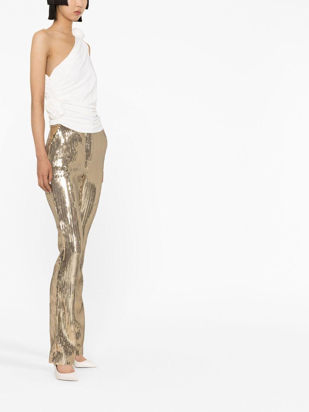 Top monospalla con fiore 