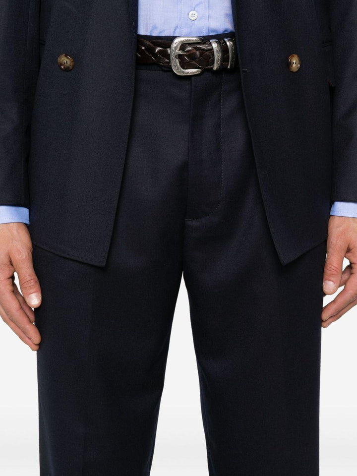 Pantaloni blu scuro in lana plissettati con patta e tasche a filetto 