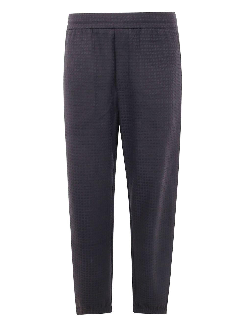 Pantaloni grigio scuro con lavorazione in rilievo 