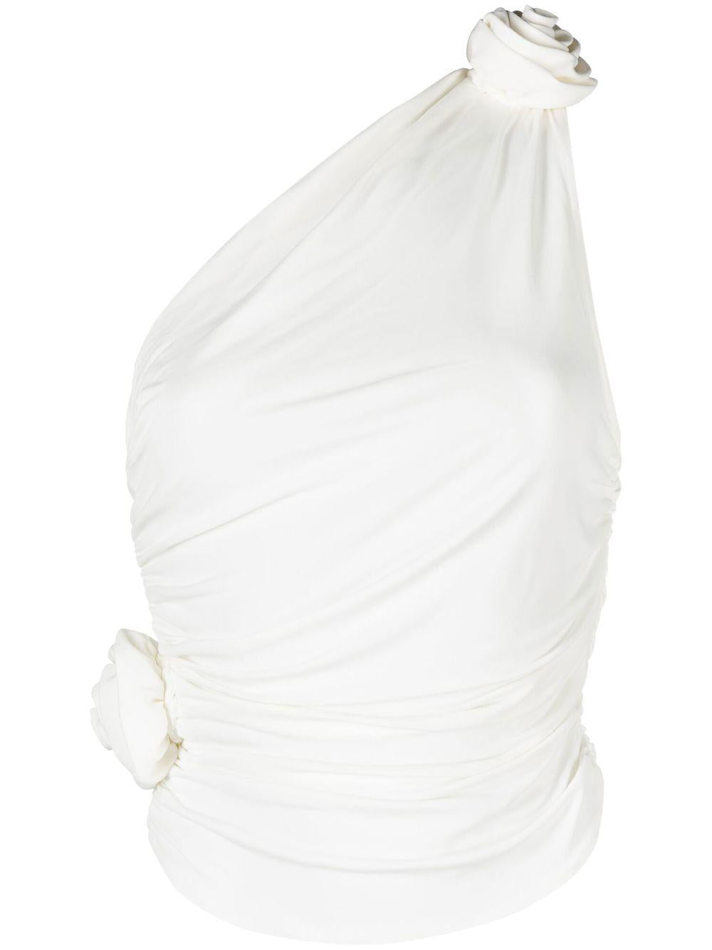 Top monospalla con fiore 