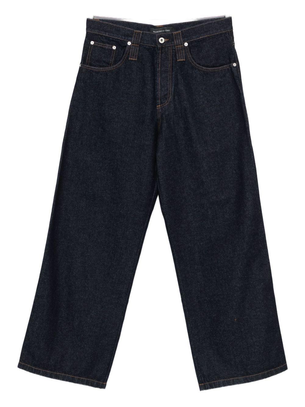 Jeans blu con cuciture a contrasto 