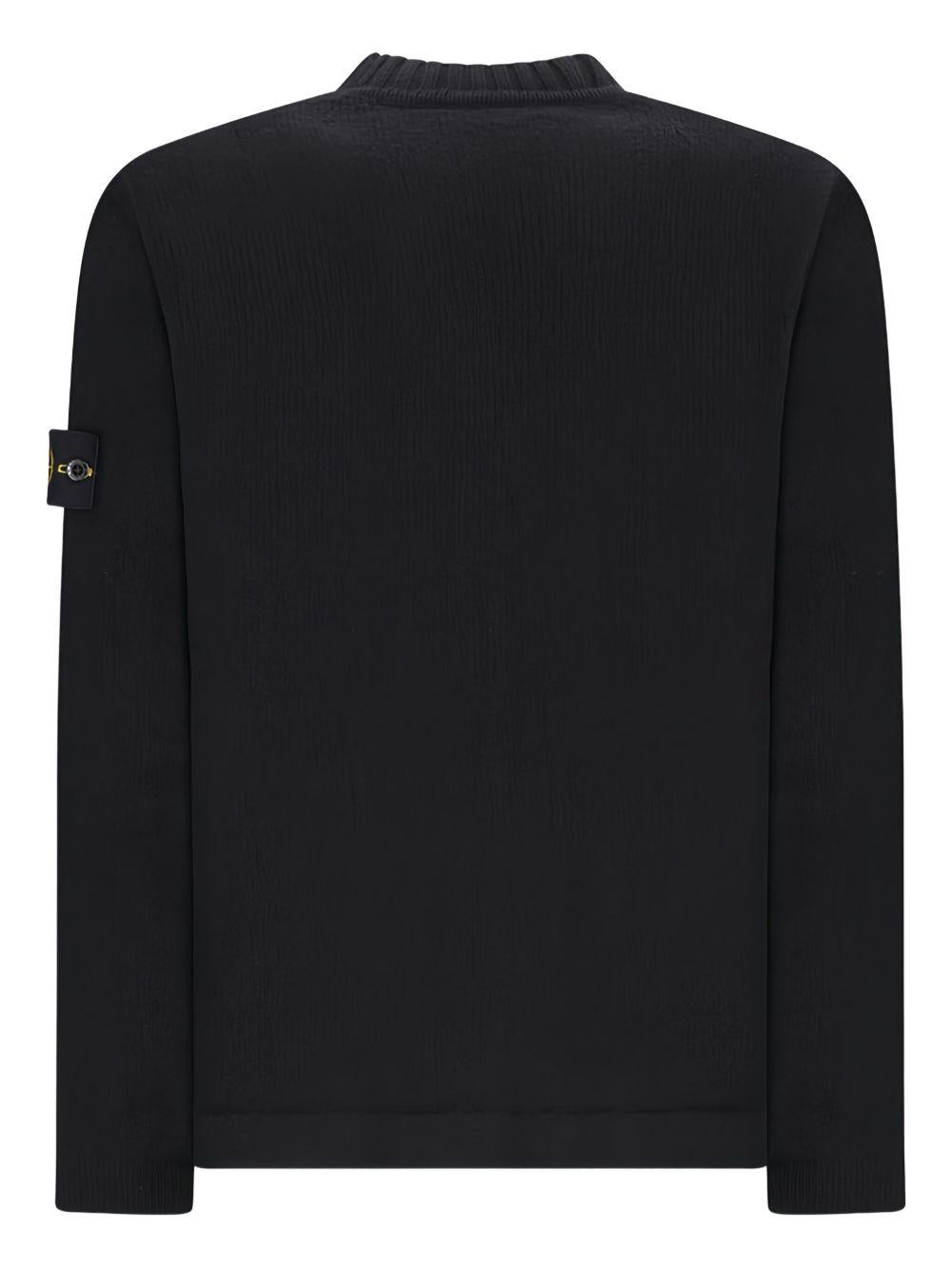 Maglione nero a coste con applicazione Compass
