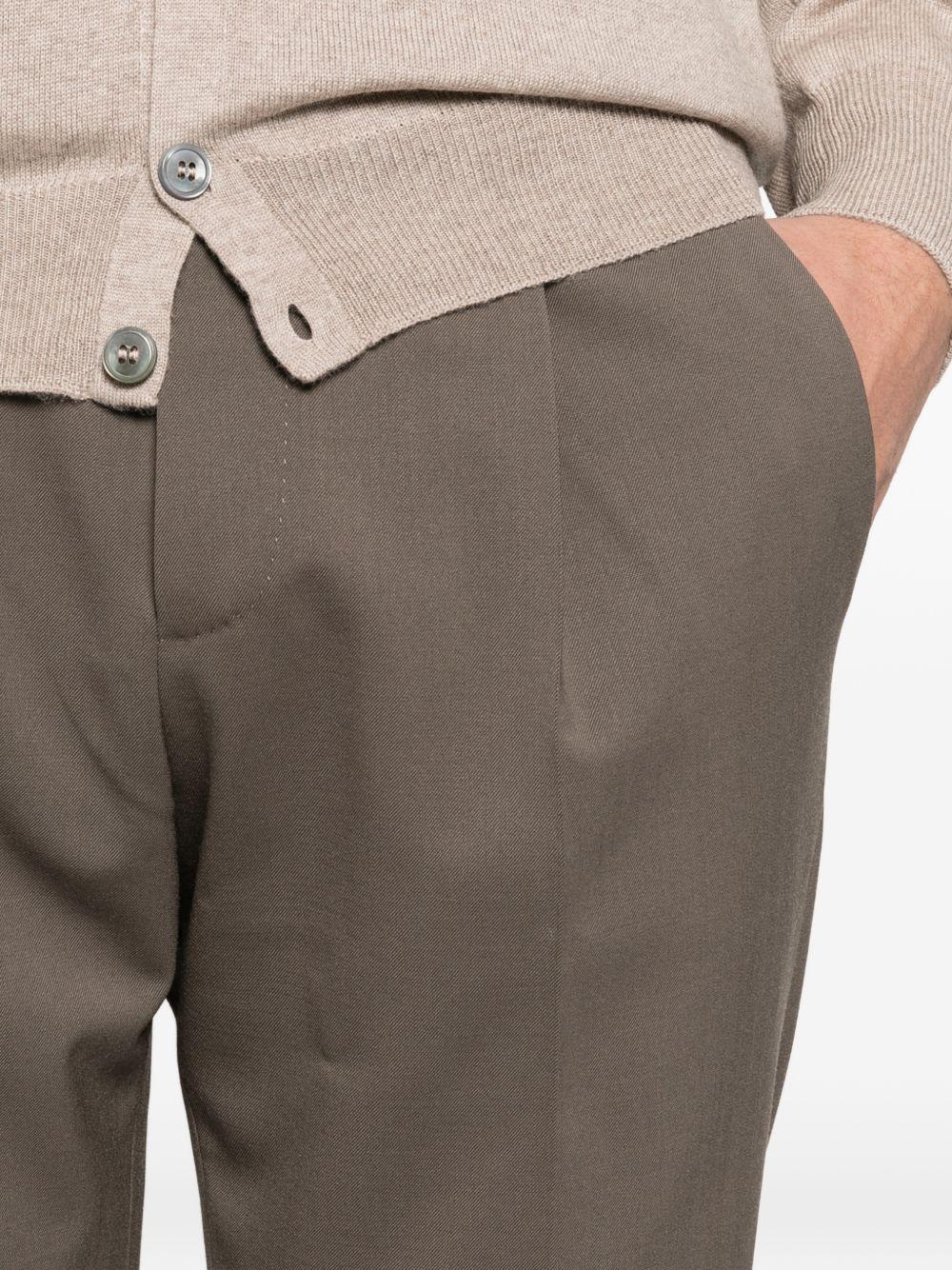 Pantaloni grigi con polsini plissettati 