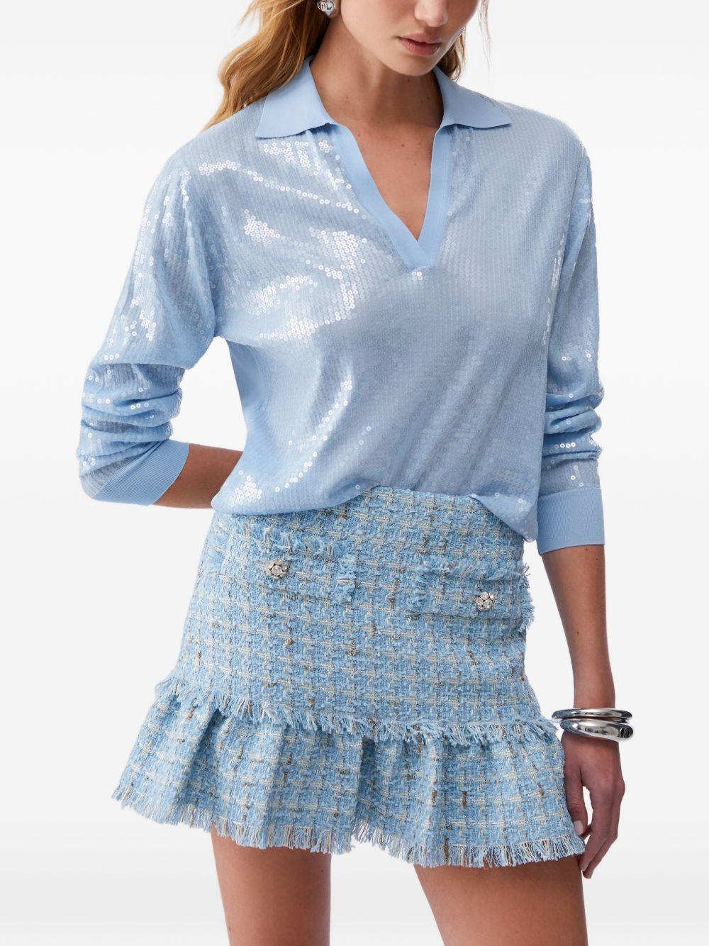 Polo con paillettes 