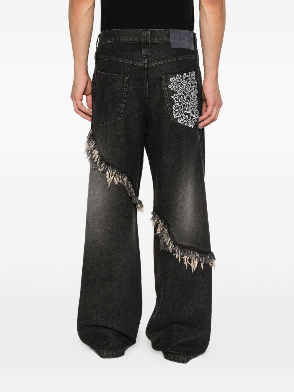 Jeans neri con frange 