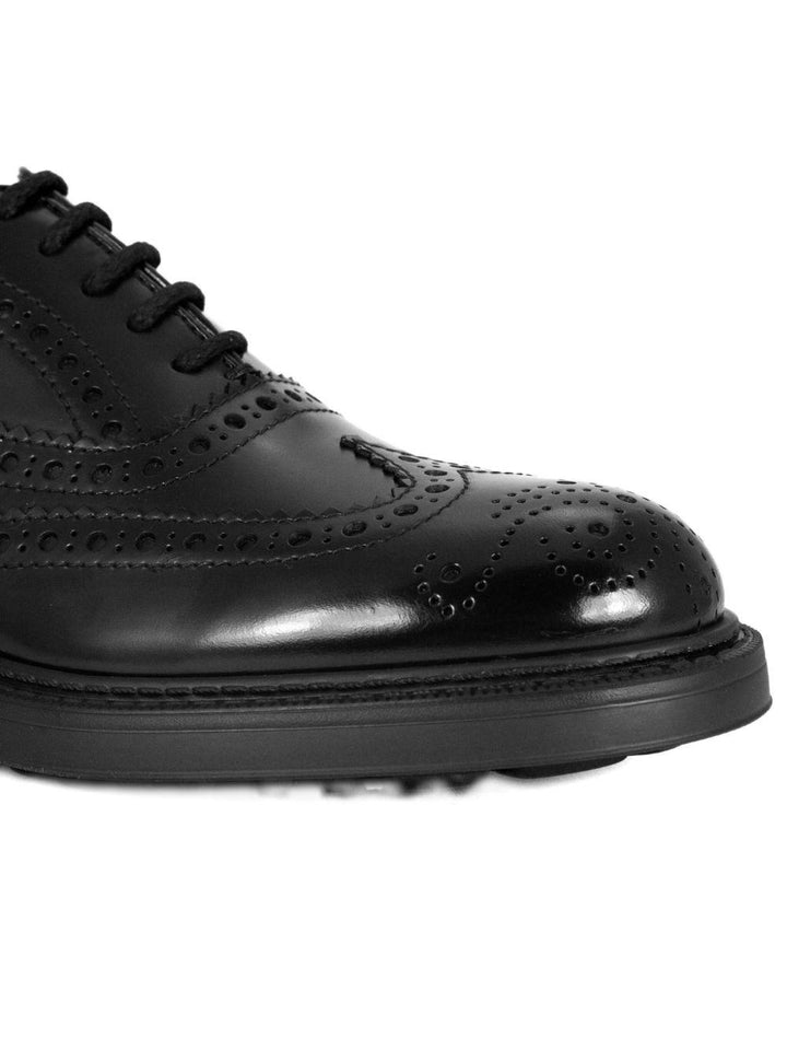 Oxford nere in pelle con design wingtip 