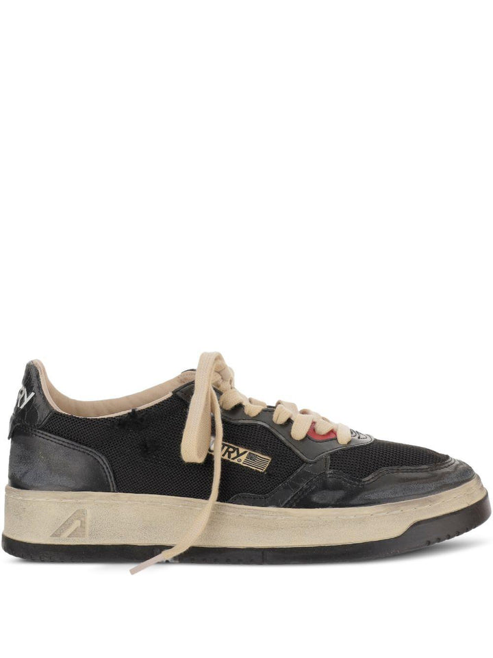 Sneakers nere con inserti 